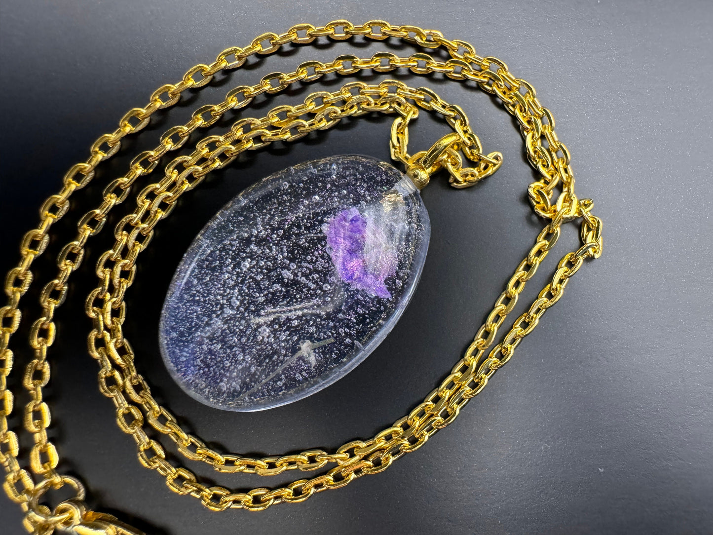 Dried Purple Flowers with Gold Leaf in Clear Half Oval Epoxy Resin Long Gold Chain Pendant