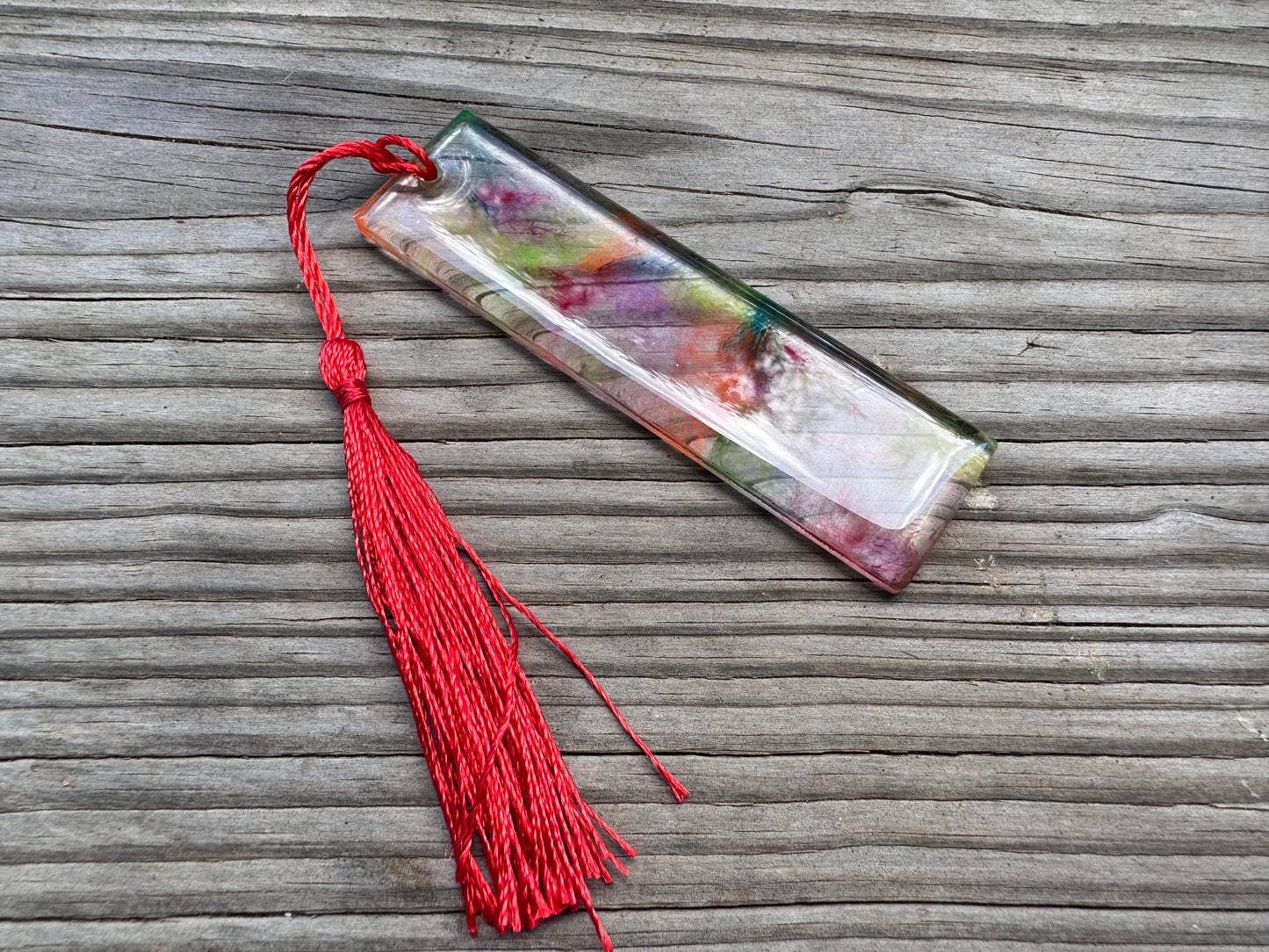 1.2 x 3.8 Flexible Bookmark UV Rainbow Clear Marbled Resin with Red Tassel